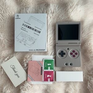 Gray Handheld Console with Classic Gamepad Design
